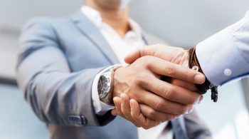 Handshake of businessmen greeting each other