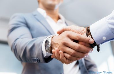 Handshake of businessmen greeting each other